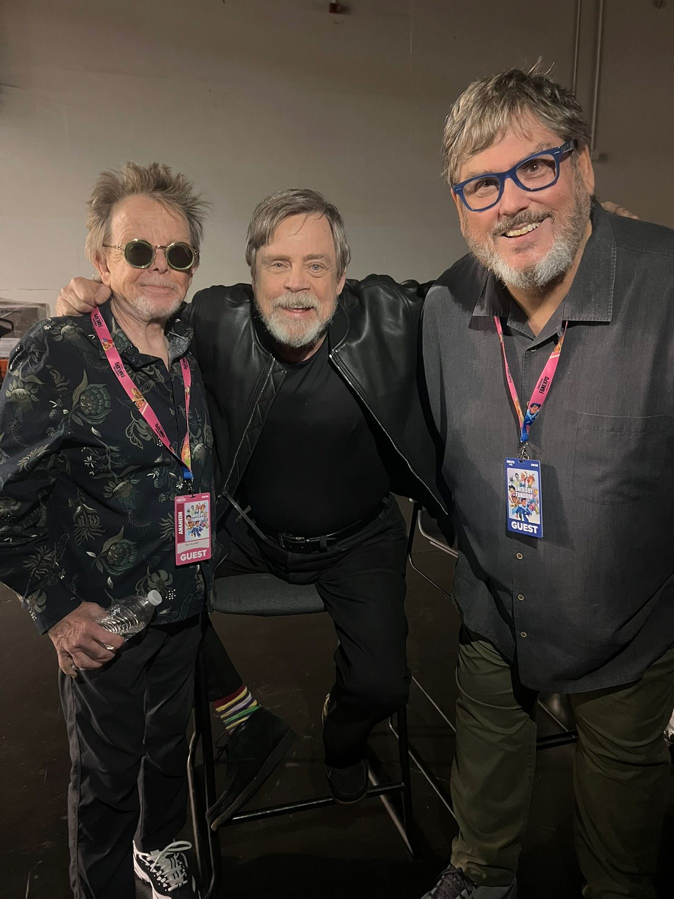 Mark Hamill with two friends backstage at a convention